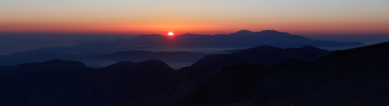 Sun rising over Dia island and Oros Giouhtas mountais.  
